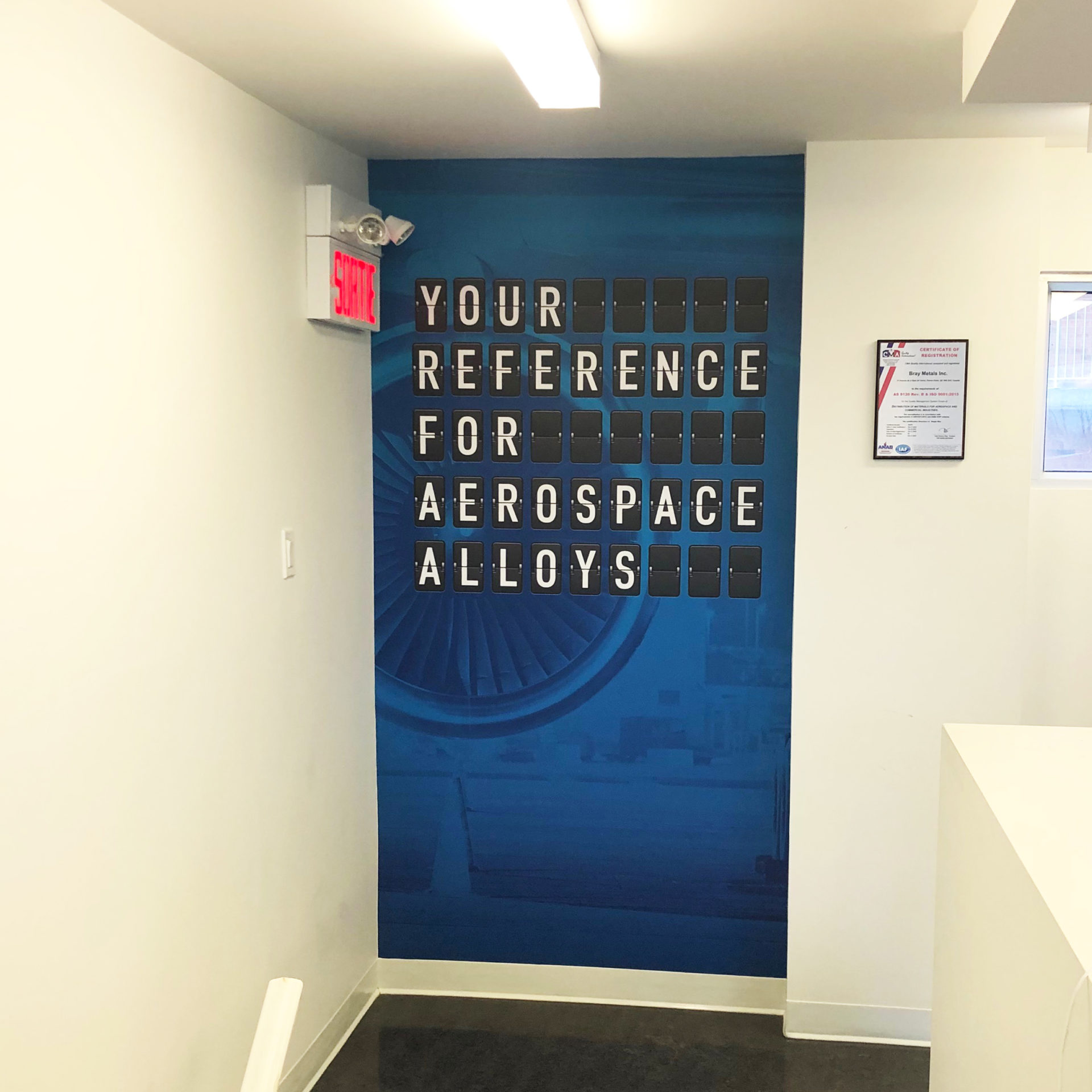 Wall Decals at Bray Metals offices in Pointe-Claire, Montreal. Written 'Your reference for aerospace alloys'.